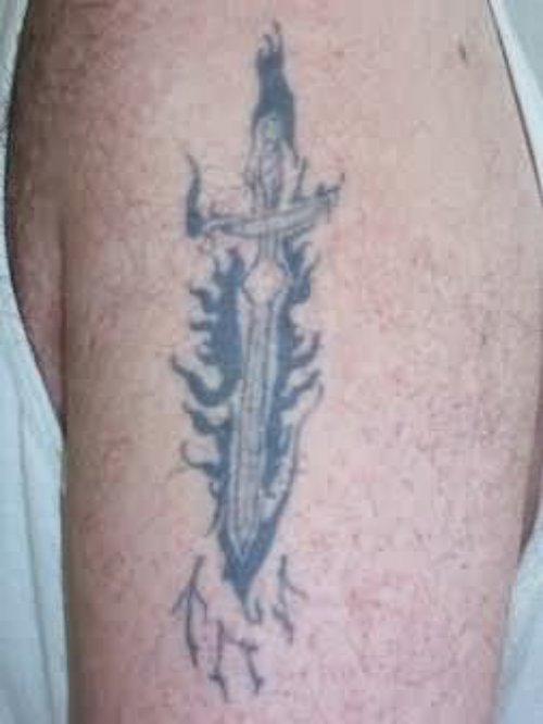 Grey Ink Dagger Tattoo On Man Left Shoulder