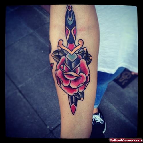 dagger with rose petals tattoo