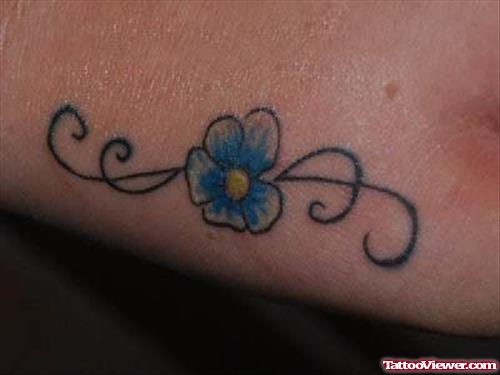 Blue Ink Daisy Tattoo
