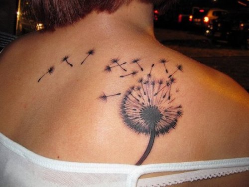 Flying Dandelion Seeds Tattoo On Back
