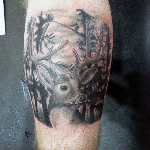 Grey And Black Deer Head Tattoo On Back Leg