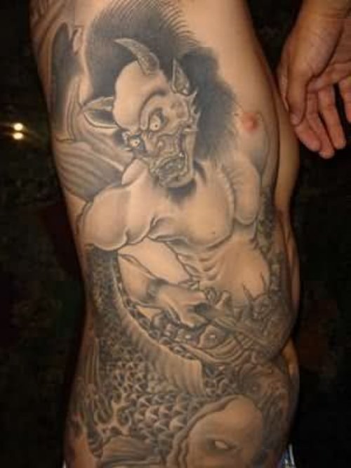 Chinese Demon Tattoo On Man Rib Side