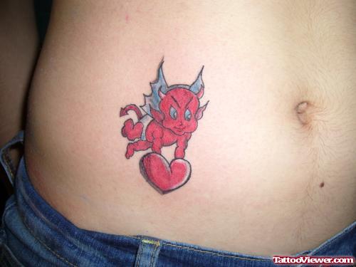 Little Devil With Heart Tattoo Design On Belly