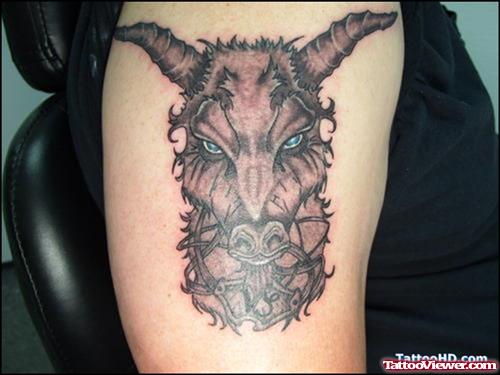 Grey Ink Devil Head Tattoo On Right Bicep