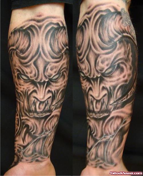 Grey Ink Devil Tattoo On Forearm