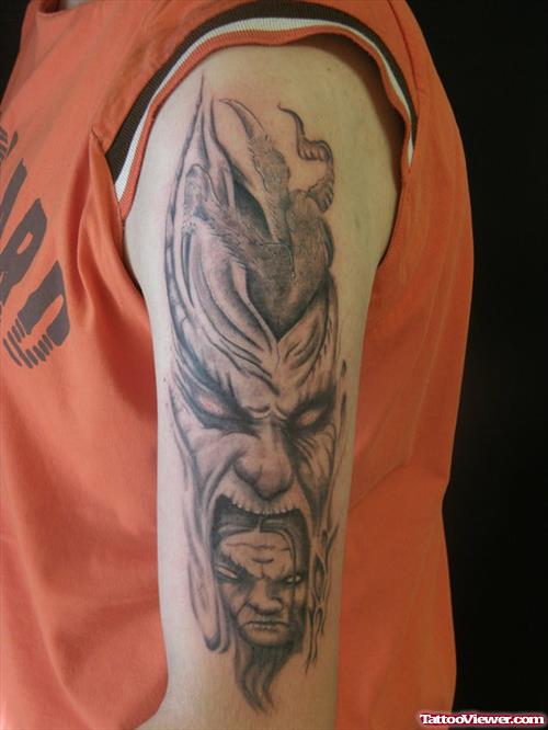 Grey Ink Devil Head Tattoo On Left Half Sleeve