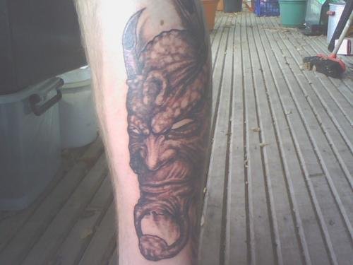 Awesome Grey Ink Devil Head Tattoo On Leg