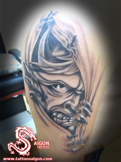 Ripped Skin Devil Tattoo