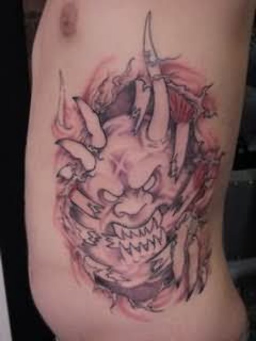 Devil Face Tattoo on Rib