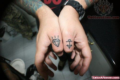 Anchor And Diamond Tattoo On Thumbs