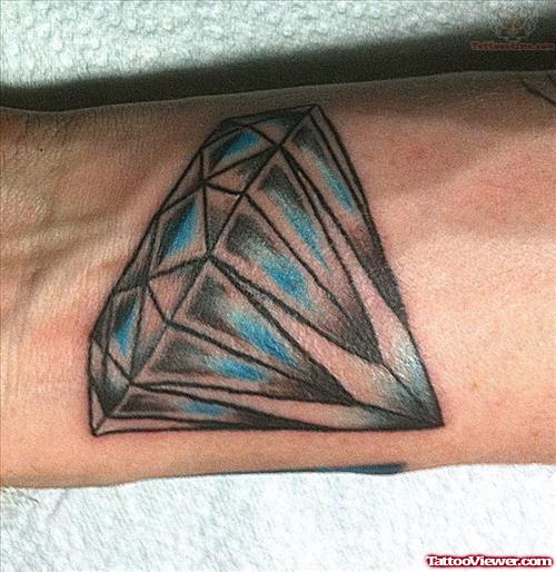 Black And Blue Ink Diamond Tattoo On Arm