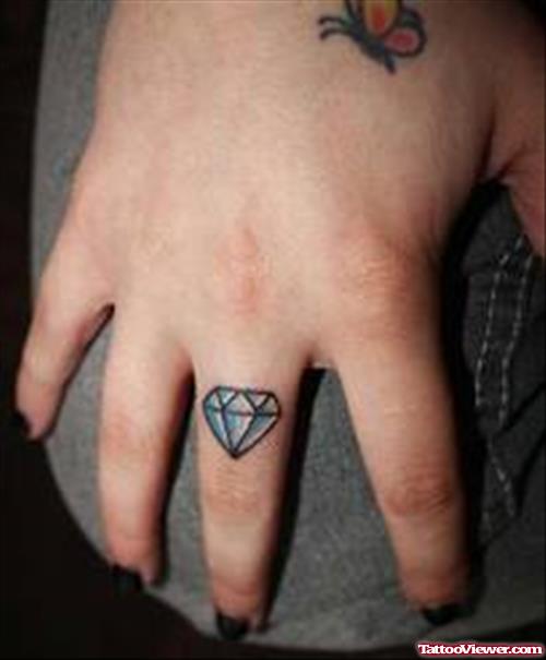 Butterfly And Diamond Tattoo On Finger