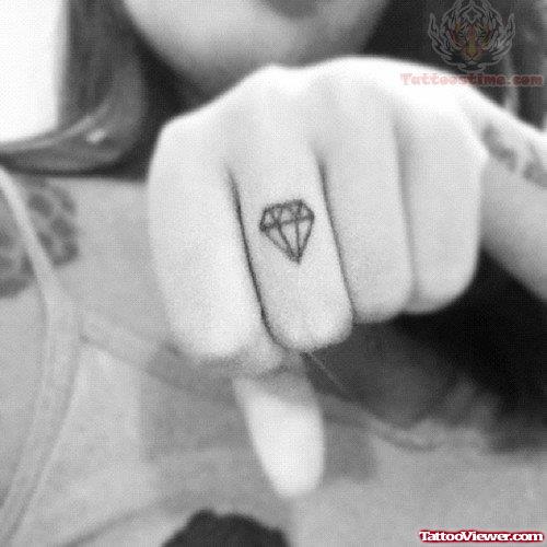 Tiny Diamond Ring Tattoo