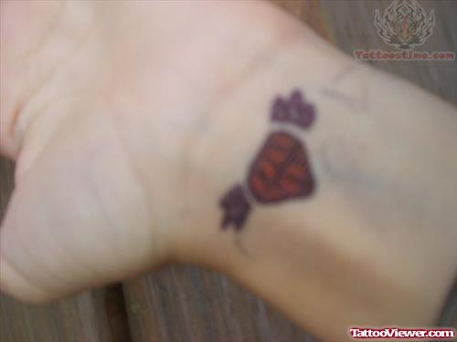 Tiny Red Diamond Tattoo On Wrist