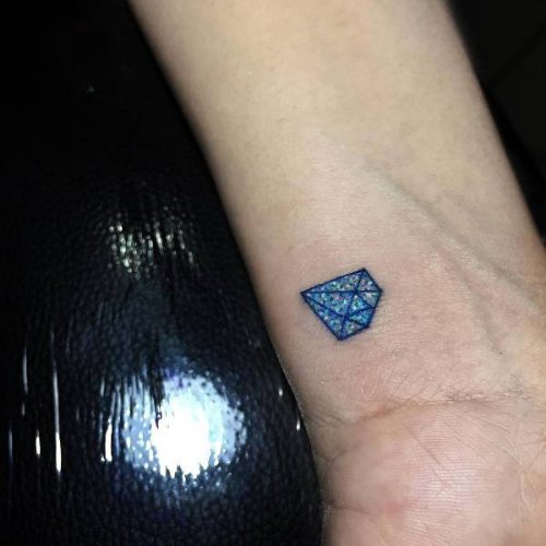Tiny Blue Diamond Tattoo On Wrist