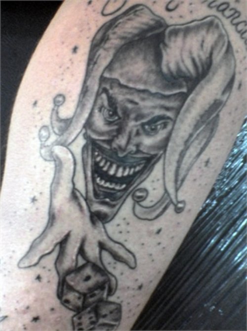 Grey Ink Evil Clown Dice Tattoo