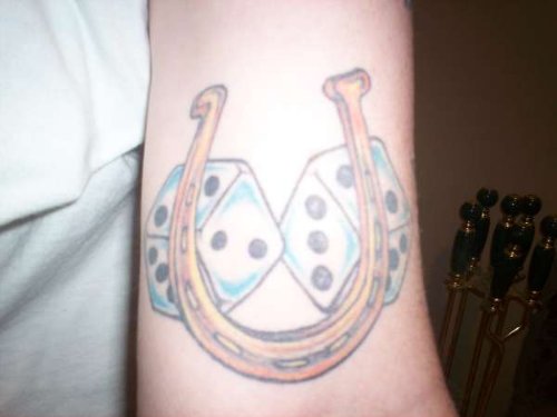 Horse Shoe and Blue Dice Tattoos On Arm