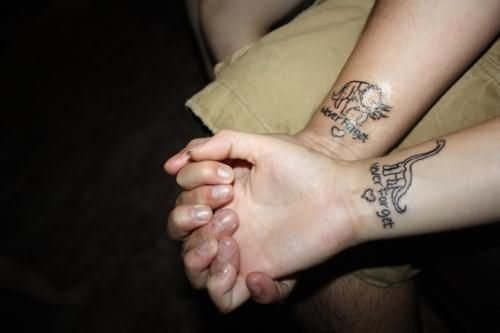 Grey Ink Wrists Dinosaur Tattoo