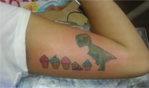 Cupcakes And Dinosaur Tattoo On Half Sleeve