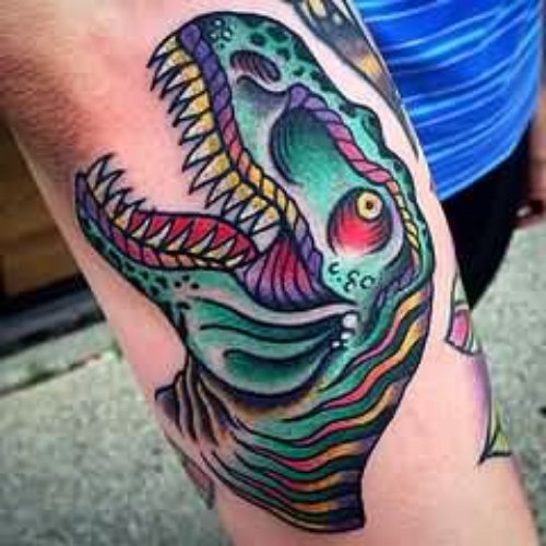 Colored Dinosaur Tattoo On Sleeve