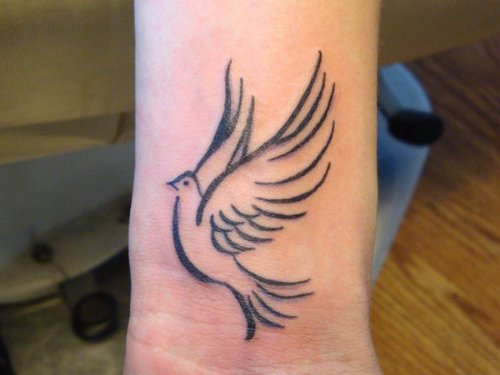 Tribal flying Dove Tattoo On Wrist