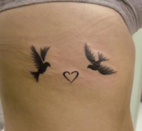 Small Heart And Flying Dove Tattoos On Side Rib