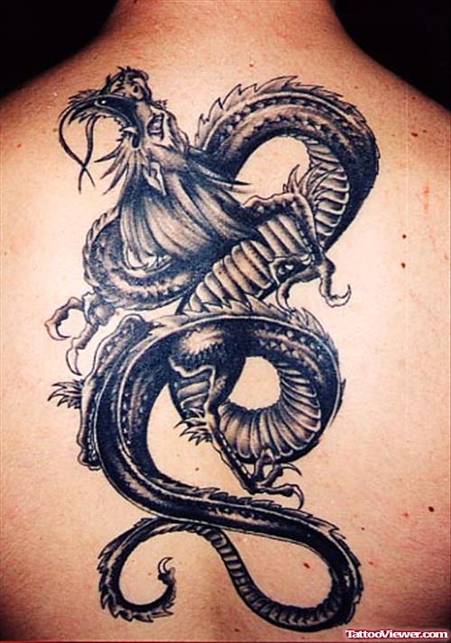Impressive Grey Ink Dragon Tattoo On Upperback