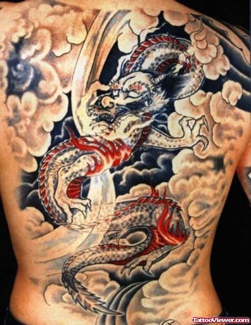 Awesome Colored Dragon In Clouds Tattoo On Back