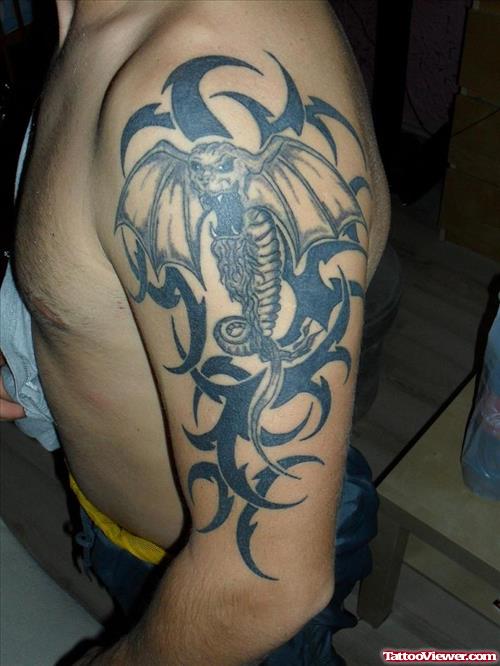 Black Trbal And Dragon Tattoo On Half Sleeve