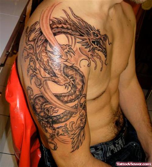 Beautiful Grey Ink Dragon Tattoo On Man Right Half Sleeve