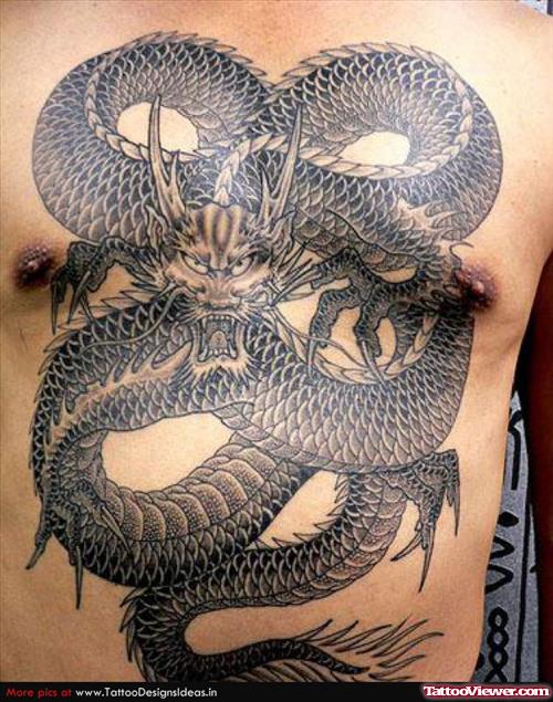 Awesome Grey Ink Angry Dragon Tattoo On Man Chest