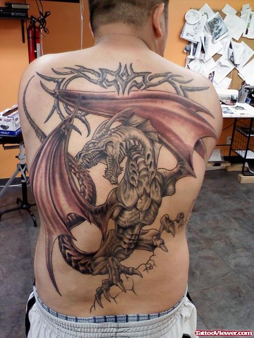 Tribal And Grey Ink Dragon Tattoo On Man Back