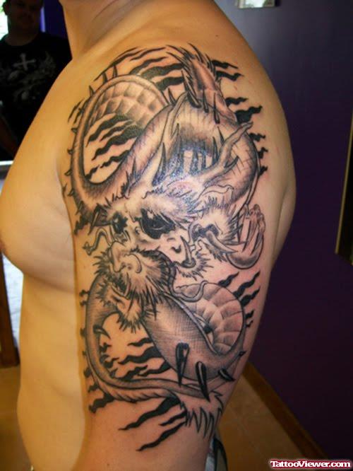 Awesome Grey Ink Dragon Tattoo On Man Left Half Sleeve