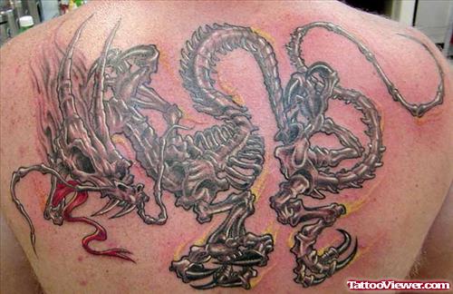 Grey Ink Dragon Skeleton Tattoo On Back Body