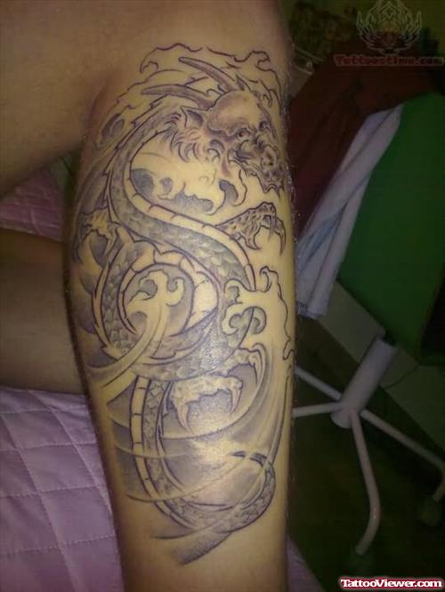 Grey Ink Dragon Tattoo On Right Leg