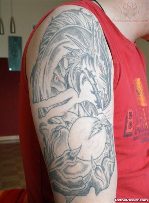 Grey ink Dragon Tattoo On Bicep