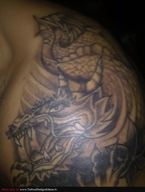 Grey Ink Dragon Tattoo On Man Left SHoulder