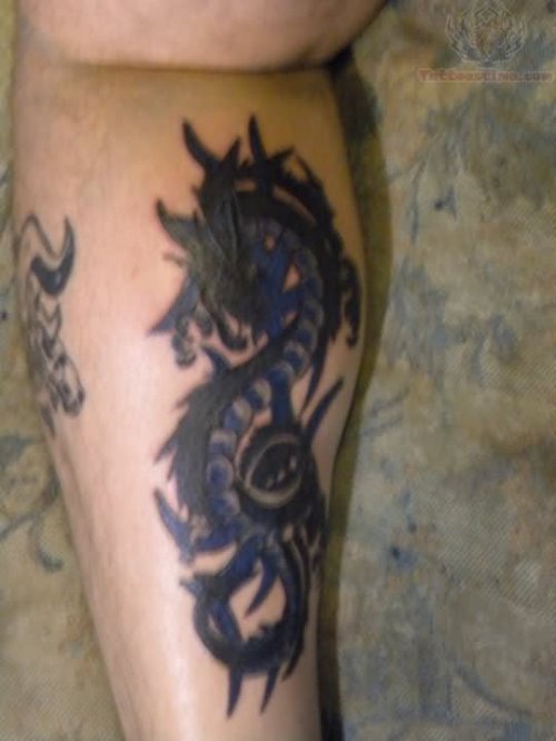 Men With Dragon Tattoo On Back Leg