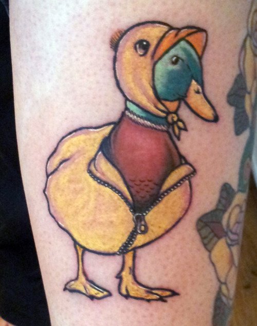 Duck With Yellow Dress Tattoo On Bicep