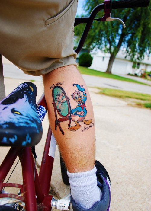 Donald Duck In Front Of Mirror Tattoo On Back Leg