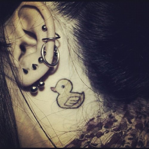 Girl With Duck Tattoo Behind Ear