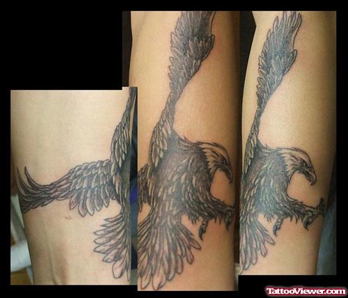 Grey Ink Eagle Flying Tattoo