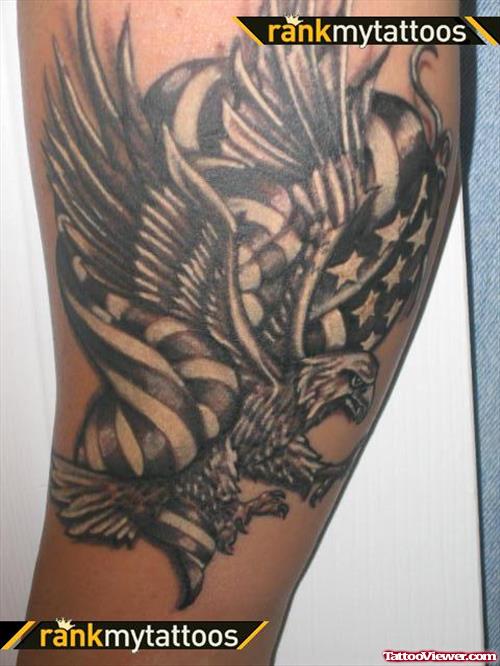 Grey Ink Flying Bald Eagle With American Flag Tattoo