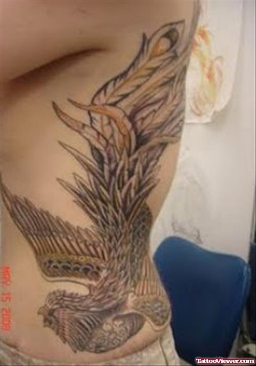 Grey Ink Flying Eagle Tattoo On Left Side Rib