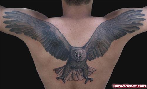 Man With Eagle Tattoo On Upperback