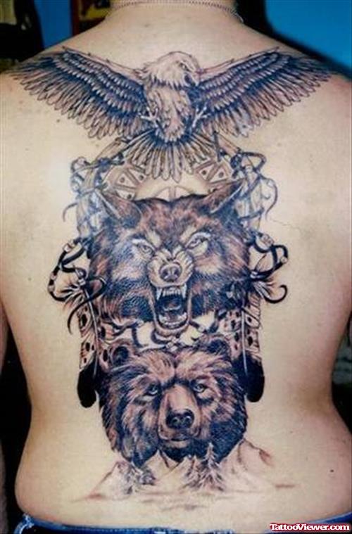 Flying Eagle And Wolf Head Tattoo On Back