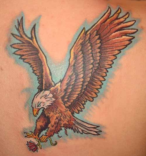 Eagle With Lotus Flower In Claw Tattoo