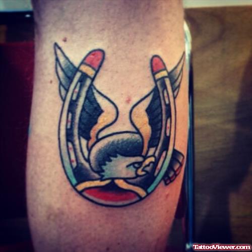 eagle with wings and horseshoe tattoo