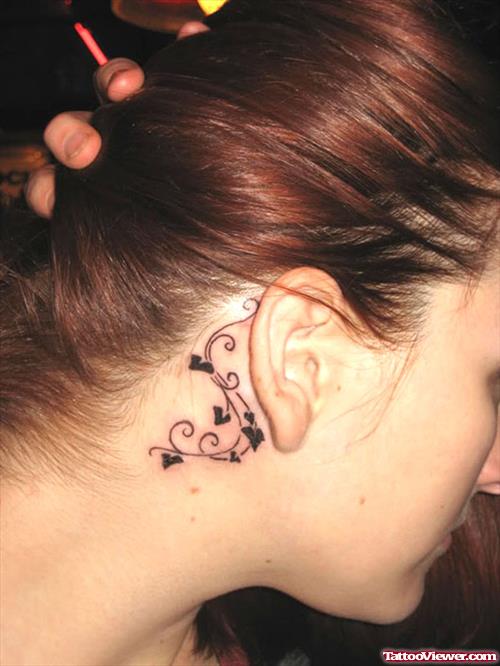 Swairl Tattoo On Behind Ear