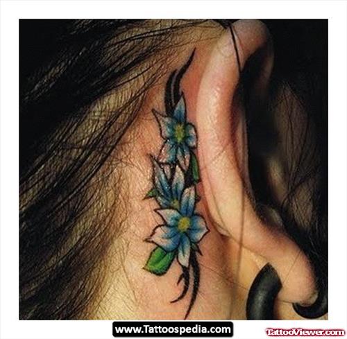 Blue Flowers And Tribal Ear Tattoo Tattoo